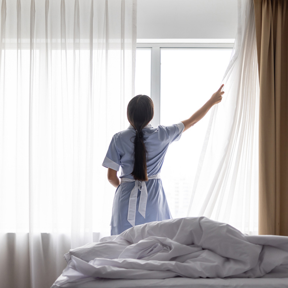 a man standing on a bed